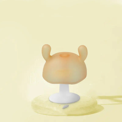 Cute silicone baby teether on a beige background