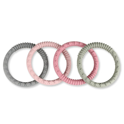 Set of four silicone baby teething rings in pink and gray on a white background