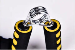 Close-up of a spring-loaded hand grip with black and yellow handles on a white background