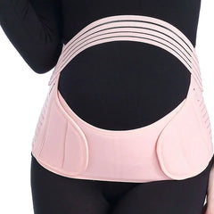 Pink maternity waist support belt with multiple straps modeled by woman