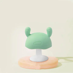 Cute silicone baby teether on a beige background