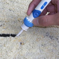 Person demonstrating using a white and blue tool ear cleaning suction device by sucking up cracker crumbs