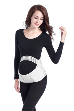 Woman wearing a black long-sleeve top and black leggings with a white maternity belt on a white background