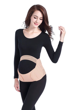 Woman wearing a black long-sleeve top and black leggings with a beige maternity belt on a white background